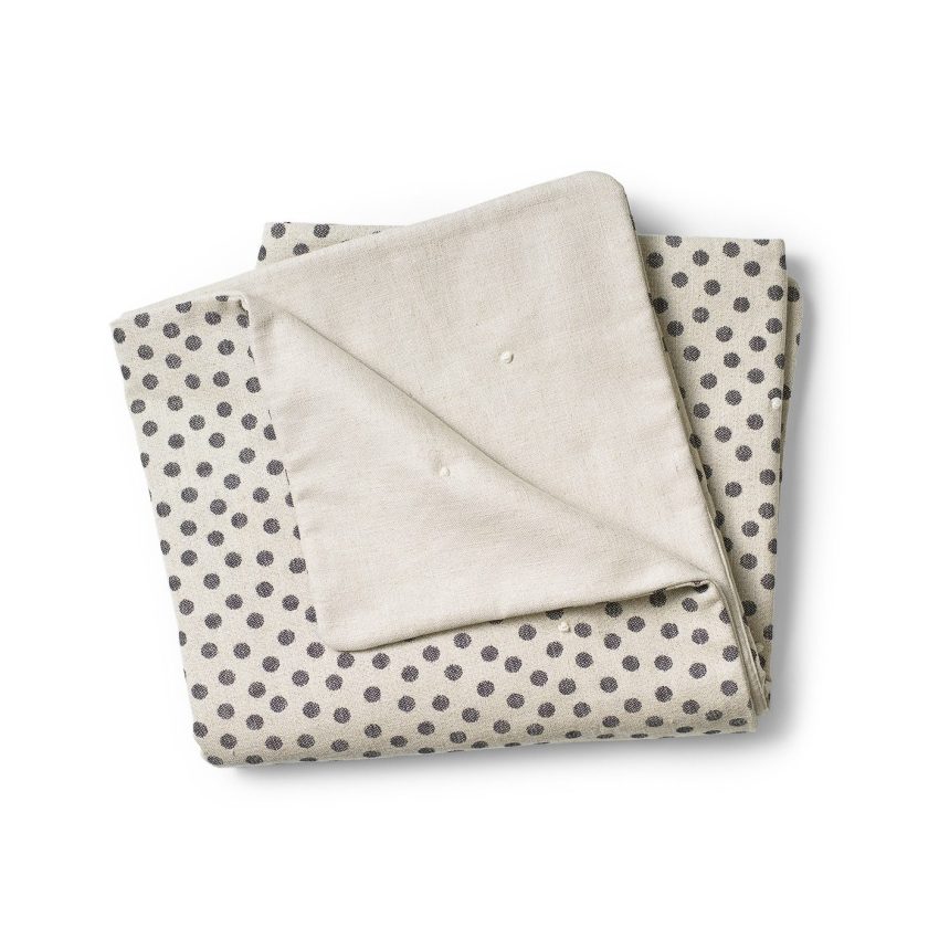 Linen cover with one patterned side and one plain side.
