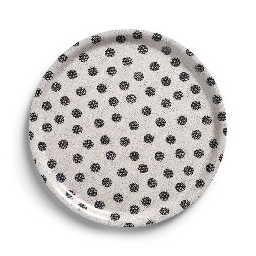 The picture shows a dots tray in molded birch veneer. The dotted pattern has a linen texture.