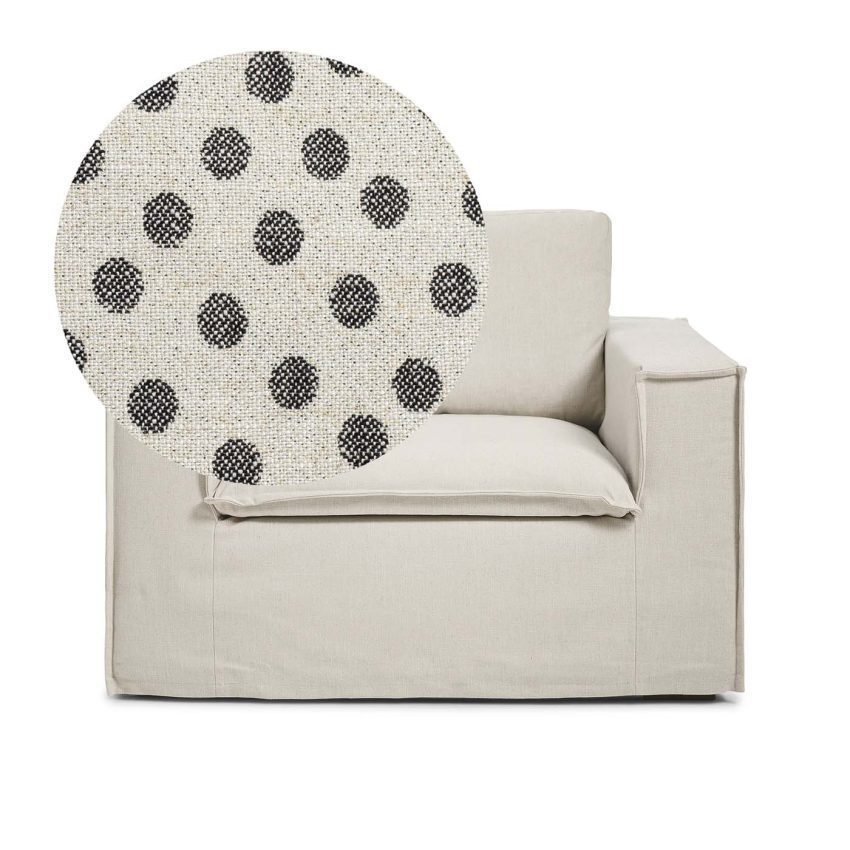 Luca Armchair Dotted is a spacious armchair in linen with black dots from Melimeli